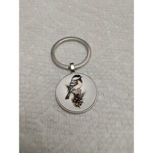Chickadee bird on pine cone key chain.